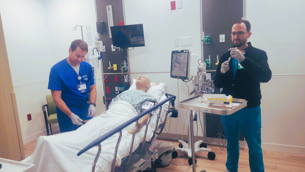 Pharmacy Residents practicing techniques in simulation room